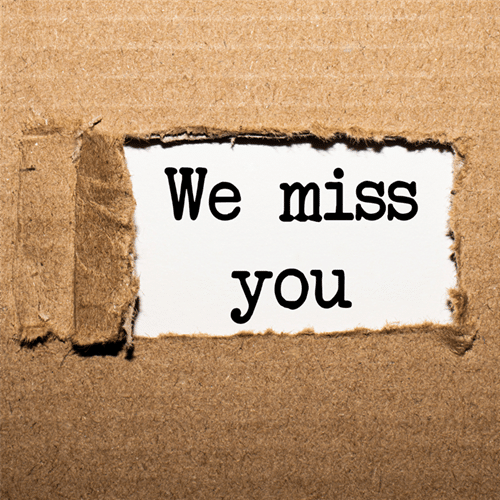 The text We miss you as if unwrapped from a package
